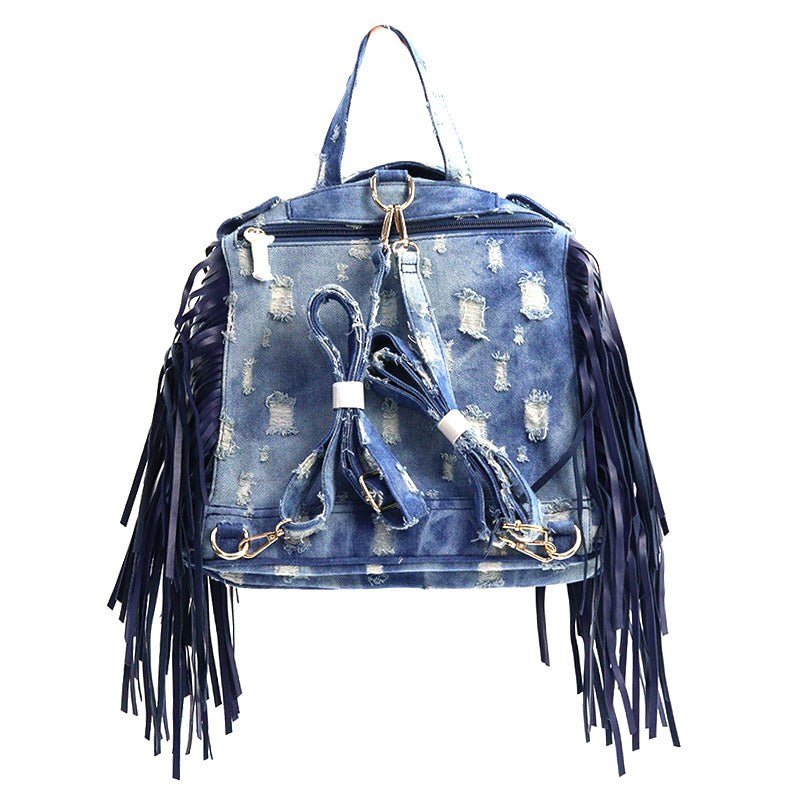 Statement denim purse featuring moto-inspired style and  fringe detail