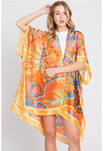 Orange floral beach or pool cover up for summer vacation
