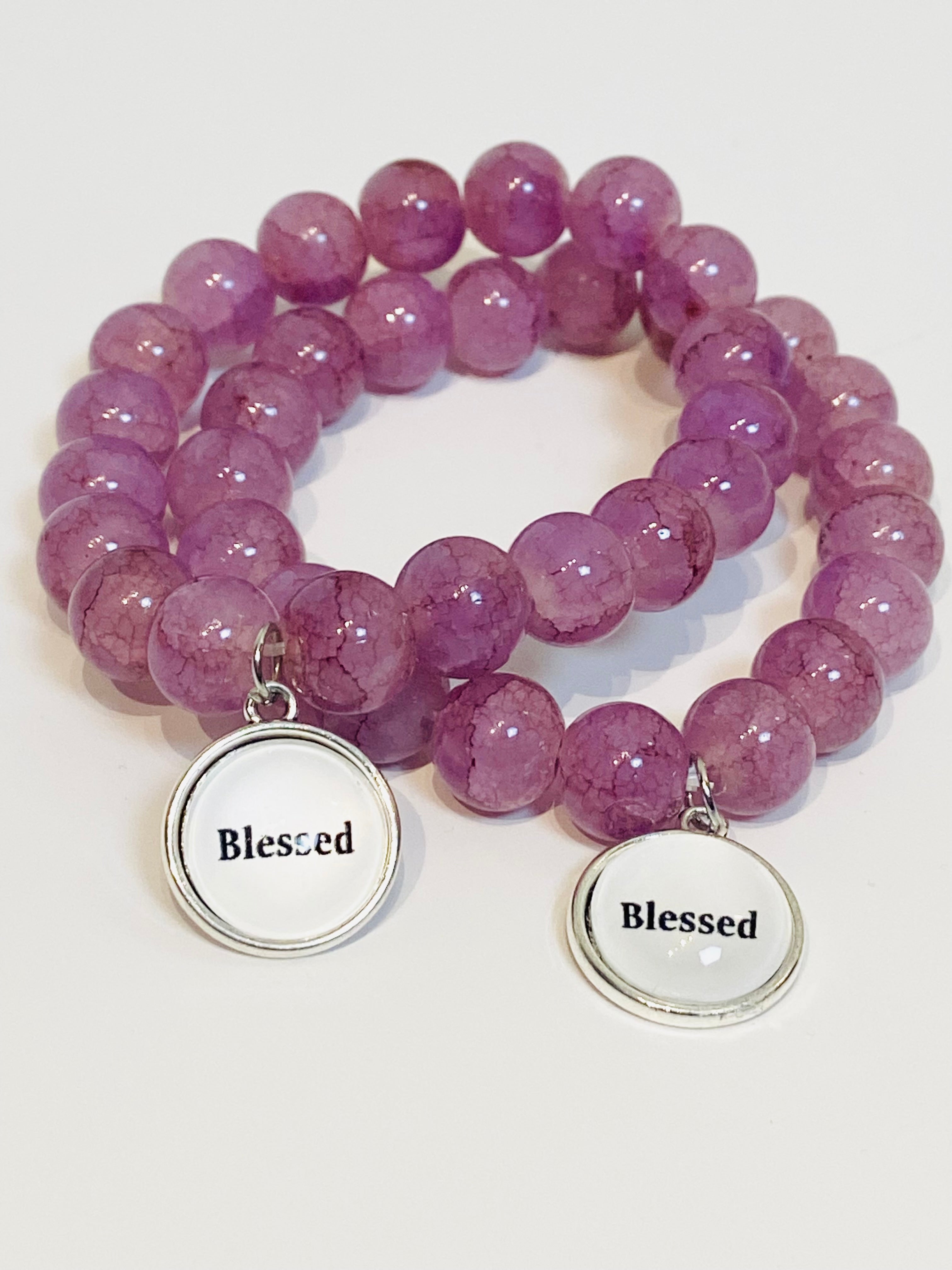 Purple beaded stretch bracelet with charm