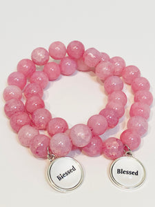 Pink beaded stretch bracelet with charm
